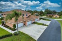This affordable first-floor 3-bedroom, 2-bath home with a 2-car for sale in Lehigh Acres Florida Lee County County on GolfHomes.com