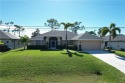 Welcome to your dream home in Cape Coral located on Palmetto for sale in Cape Coral Florida Lee County County on GolfHomes.com