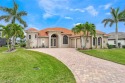 Luxurious lakefront pool home in the Royal Tee Country Club for sale in Cape Coral Florida Lee County County on GolfHomes.com