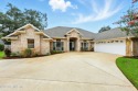 This beautiful brick home is ideal for multi-generational living for sale in Jacksonville Florida Duval County County on GolfHomes.com