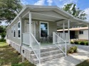 This home has barley been lived in and comes with a Transferable for sale in Lady Lake Florida Lake County County on GolfHomes.com