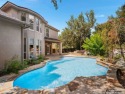 Nestled on a quiet, secluded corner lot in the gated community for sale in San Antonio Texas Bexar County County on GolfHomes.com