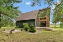 Experience refined lake living in this stunning 3BR, 2BA home for sale in Arkdale Wisconsin Adams County County on GolfHomes.com
