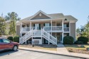 Discover the perfect blend of comfort and coastal charm at this for sale in Pawleys Island South Carolina Georgetown County County on GolfHomes.com