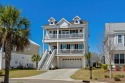 This custom-built raised beach home in the gated community of for sale in Myrtle Beach South Carolina Horry County County on GolfHomes.com