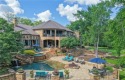 This custom estate sits on a rare 1.4-acre wooded lot backing to for sale in Bryan Texas Brazos County County on GolfHomes.com