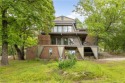 Discover this one-of-a-kind, three-level home nestled on two for sale in Holiday Island Arkansas Carroll County County on GolfHomes.com