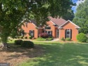 All brick ranch on Georgia National golf course and overlooking for sale in Mcdonough Georgia Henry County County on GolfHomes.com