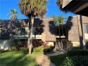 This second floor condo overlooks the fairway of the second hole for sale in Naples Florida Collier County County on GolfHomes.com