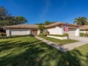 Nestled in the highly sought-after 55+ community of Highland for sale in Palm Harbor Florida Pinellas County County on GolfHomes.com