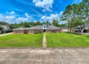 This gorgeous 4 bedroom, 4 bath home is situated on a .6 acre for sale in Beaumont Texas Jefferson County County on GolfHomes.com