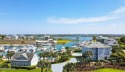 Experience the ultimate in waterfront living with this stunning for sale in Hampstead North Carolina Pender County County on GolfHomes.com