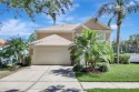 Welcome to this lovingly maintained 4-bedroom, 2.5-bath home for sale in Tampa Florida Hillsborough County County on GolfHomes.com
