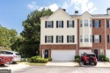 Welcome to this beautifully maintained three-level end-unit for sale in Sugar Hill Georgia Gwinnett County County on GolfHomes.com