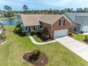 Welcome to 41 Bear Creek Loop, nestled in the prestigious for sale in Murrells Inlet South Carolina Georgetown County County on GolfHomes.com