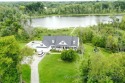 Custom built, one owner ranch on 17.2 peaceful acres with 840' for sale in Alto Michigan Kent County County on GolfHomes.com