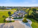 Up Up and away to your new turn-key estate home perfectly for sale in Wellington Florida Palm Beach County County on GolfHomes.com