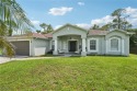 This charming traditional ranch home offers the perfect blend of for sale in Lehigh Acres Florida Lee County County on GolfHomes.com