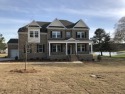 This stately Seneca plan backs up to the golf course and it is for sale in North Augusta South Carolina Edgefield County County on GolfHomes.com
