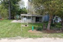 Just in time for summer. This beautiful cottage on a double lot for sale in Deckerville Michigan Sanilac County County on GolfHomes.com