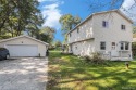 This 2 story colonial on a quarter acre comes with access/lake for sale in Pinckney Michigan Livingston County County on GolfHomes.com