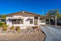 Bright and open 2BD, 2 BA double wide home within Tucson Estates for sale in Tucson Arizona Pima County County on GolfHomes.com