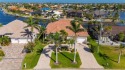 Experience exceptional waterfront living in this custom-built for sale in Punta Gorda Florida Charlotte County County on GolfHomes.com