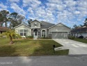 Welcome to 5 Wayside Pl, a beautifully crafted 4-bedroom for sale in Palm Coast Florida Flagler County County on GolfHomes.com