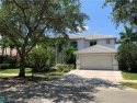 Welcome home to prestigious Weston Hills and enjoy Country Club for sale in Weston Florida Broward County County on GolfHomes.com