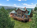 This beautiful two-level mountain chalet is nested among large for sale in Angel Fire New Mexico Colfax County County on GolfHomes.com
