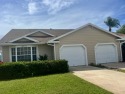 Sunrise view over the water and golf course from this 2/2/1 for sale in Fort Pierce Florida Saint Lucie County County on GolfHomes.com