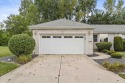 Beautifully appointed brick Paired Villa with partially finished for sale in Crown Point Indiana Lake County County on GolfHomes.com