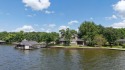 Set on a wide cove with open water views in the prestigious, Texas