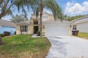 Welcome to 1305 Rebecca Dr, located in the desirable gated golf for sale in Haines City Florida Polk County County on GolfHomes.com