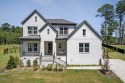 Situated atop a spacious corner lot in Hasentree, this for sale in Wake Forest North Carolina Wake County County on GolfHomes.com