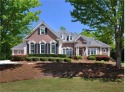 A RARE FIND! This four-sided brick RANCH-style residence with for sale in Suwanee Georgia Gwinnett County County on GolfHomes.com