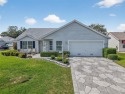 Impeccably manicured home set on a corner lot in Briar Meadow for sale in The Villages Florida Marion County County on GolfHomes.com