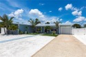Welcome to paradise with this stunning Key West style, turnkey for sale in Port Charlotte Florida Charlotte County County on GolfHomes.com