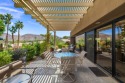 Artistically enhanced throughout.  Sitting on an elevated lot is for sale in Palm Desert California Riverside County County on GolfHomes.com