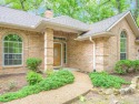 Golfers Delight! Attractive curb appeal on this 3BD-2BA-2 Living for sale in Holly Lake Ranch Texas Wood County County on GolfHomes.com
