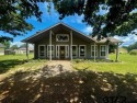 You'll find a wonderful escape from city life in this perfectly for sale in Holly Lake Ranch Texas Wood County County on GolfHomes.com