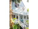 Discover your dream retreat in this stunning two-story townhouse for sale in Key West Florida Monroe County County on GolfHomes.com