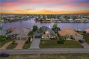 Welcome to your GULF ACCESS DREAM HOME! A commanding 4-bedroom for sale in Cape Coral Florida Lee County County on GolfHomes.com