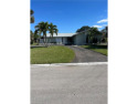 Opportunity is knocking with this 3/2 split plan heated pool for sale in Naples Florida Collier County County on GolfHomes.com