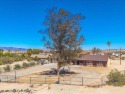 Welcome to this beautifully updated 2,055 sq ft home, ideally for sale in Twentynine Palms California San Bernardino County County on GolfHomes.com
