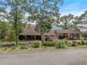 Welcome to luxury! Nestled on nearly an acre across two prime for sale in Holiday Island Arkansas Carroll County County on GolfHomes.com