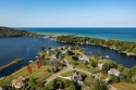 100 feet of EXCEPTIONAL LAKE FRONTAGE improved & protected with, Michigan