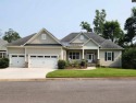 Welcome Home to 125 Bay Pointe Drive. Enjoy serene lake living for sale in Chapin South Carolina Lexington County County on GolfHomes.com