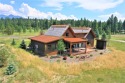 This pristine Montana cabin is situated on a quiet side street for sale in Eureka Montana Lincoln County County on GolfHomes.com