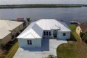 Welcome to your riverfront oasis on the scenic Peace River--a for sale in Punta Gorda Florida Charlotte County County on GolfHomes.com